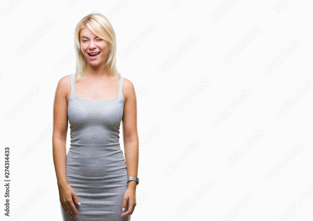 Young beautiful blonde woman over isolated background winking looking at the camera with sexy expression, cheerful and happy face. Young beautiful blonde woman over isolated background winking looking at the camera with sexy expression, cheerful and happy face.