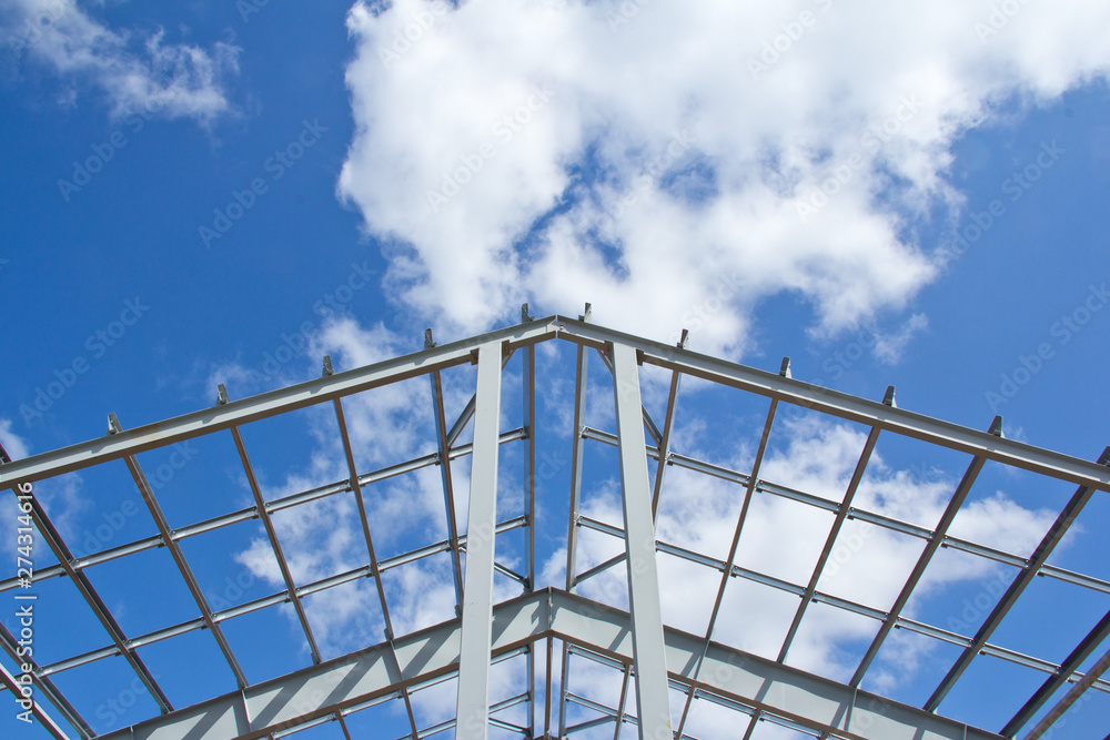 The structure of the building. Steel construction on the sky background. Electroplate steel metal. Zinc metal coating to protect against corrosion. The structure of the building. Steel construction on the sky background. Electroplate steel metal. Zinc metal coating to protect against corrosion.