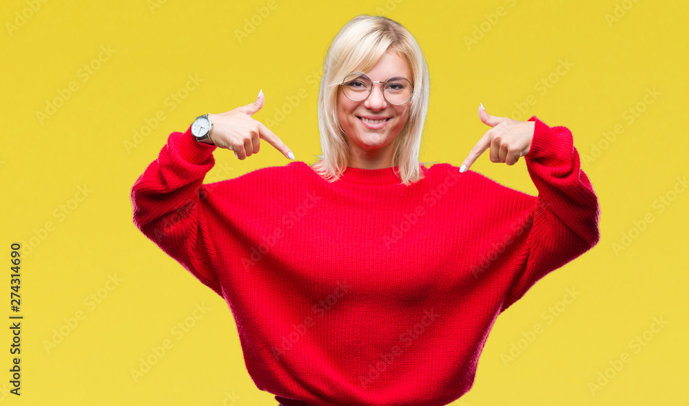 Young beautiful blonde woman wearing sweater and glasses over isolated background looking confident with smile on face, pointing oneself with fingers proud and happy. Young beautiful blonde woman wearing sweater and glasses over isolated background looking confident with smile on face, pointing oneself with fingers proud and happy.