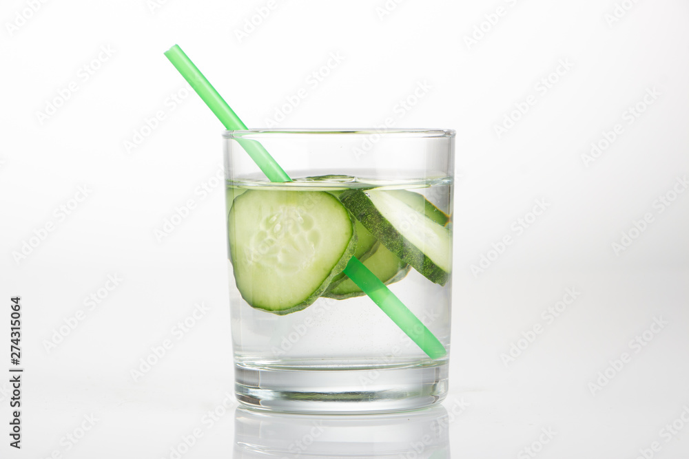 Cucumber water, cleansing water to detoxify the body and quench thirst on a white background. Cucumber water, cleansing water to detoxify the body and quench thirst on a white background.