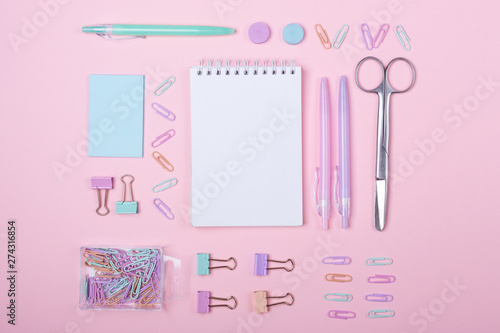 School background with notebooks and pastel colorful study accessories on pink background Back to school concept with copy space for text