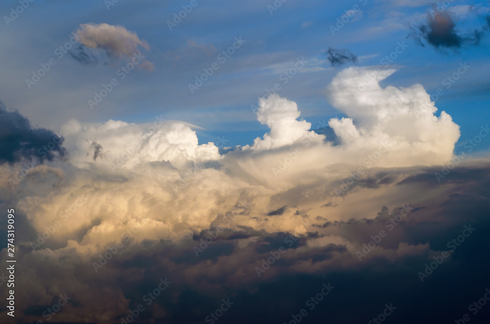 Beautiful stormy cumulus clouds in the sky, background. Beautiful stormy cumulus clouds in the sky, background.