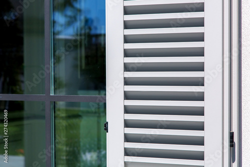 Fotografie wooden shutters of gray color, close up of the exterior of the house in the Italian style