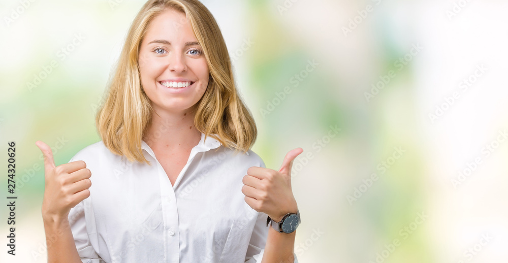 Beautiful young business woman over isolated background success sign doing positive gesture with hand, thumbs up smiling and happy. Looking at the camera with cheerful expression, winner gesture. Beautiful young business woman over isolated background success sign doing positive gesture with hand, thumbs up smiling and happy. Looking at the camera with cheerful expression, winner gesture.