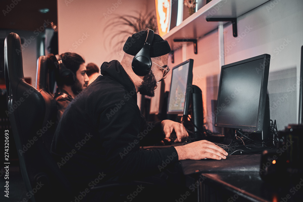 Photo of cyber sport progress - team of teenagers are playing videogames. Photo of cyber sport progress - team of teenagers are playing videogames.