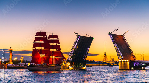 Ship with red sails sails on the Neva. Preparation for the holiday of all schoolchildren "Scarlet Sails" in St. Petersburg
