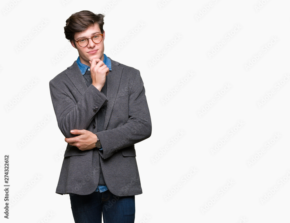 Young handsome business man wearing glasses over isolated background with hand on chin thinking about question, pensive expression. Smiling with thoughtful face. Doubt concept. Young handsome business man wearing glasses over isolated background with hand on chin thinking about question, pensive expression. Smiling with thoughtful face. Doubt concept.