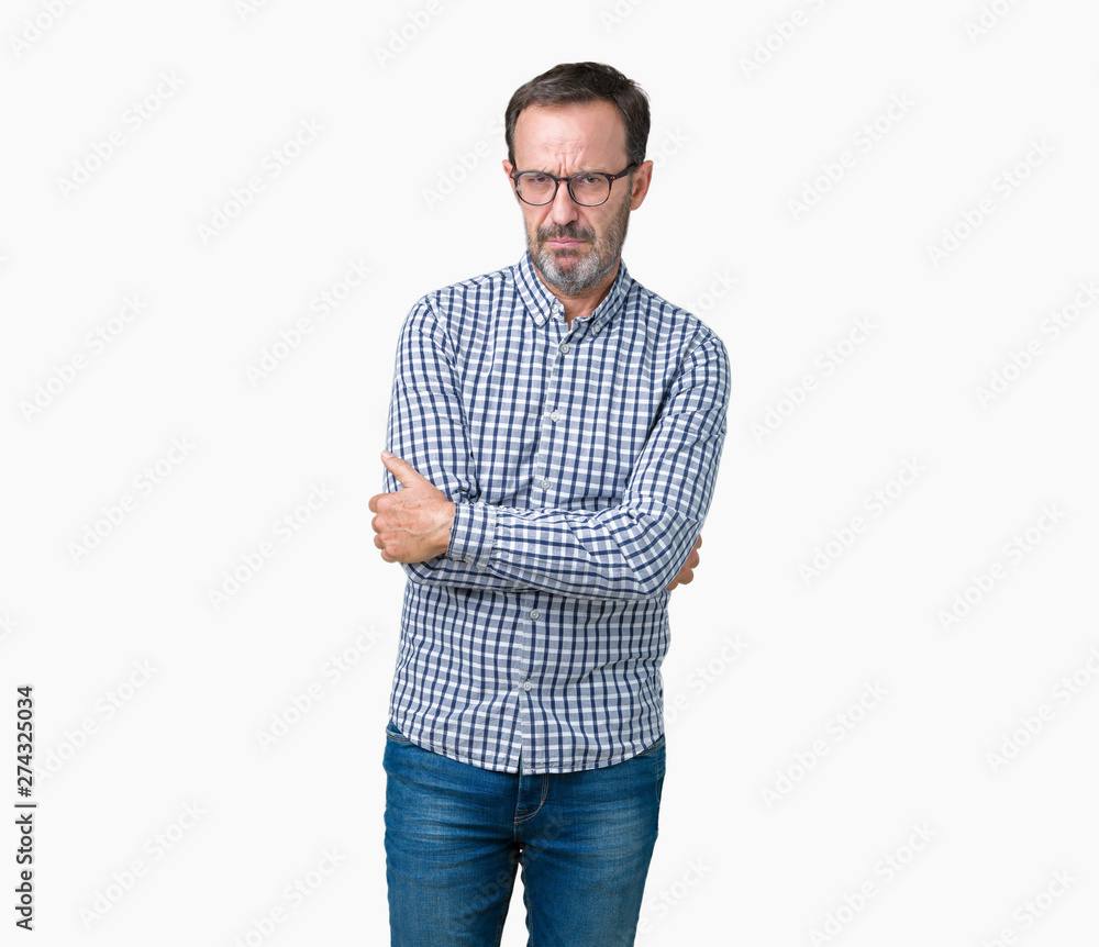 Handsome middle age elegant senior man wearing glasses over isolated background skeptic and nervous, disapproving expression on face with crossed arms. Negative person. Handsome middle age elegant senior man wearing glasses over isolated background skeptic and nervous, disapproving expression on face with crossed arms. Negative person.