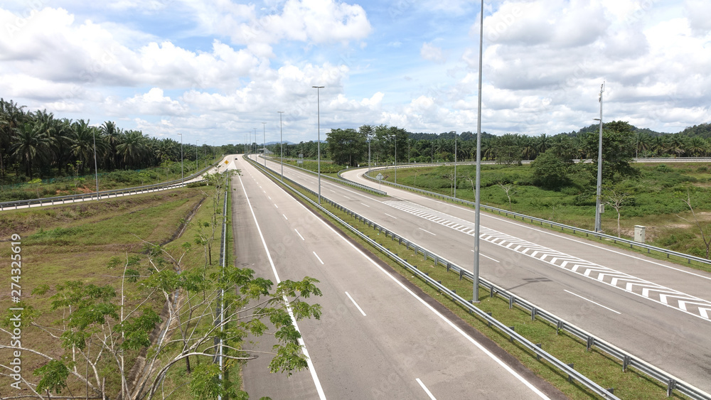 Empty highway without cars near Kuala Terengganu in Malaysia, Southeast Asia. Empty highway without cars near Kuala Terengganu in Malaysia, Southeast Asia.