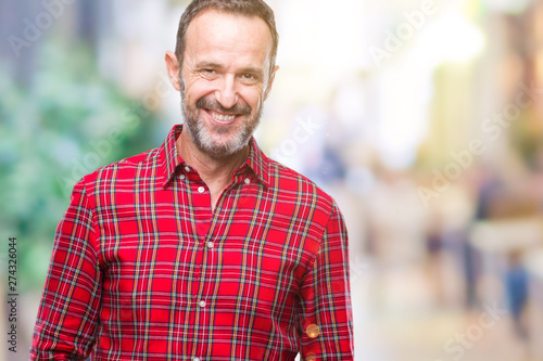 Middle age hoary senior man over isolated background with a happy and cool smile on face. Lucky person.