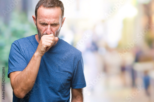 Middle age hoary senior man over isolated background feeling unwell and coughing as symptom for cold or bronchitis. Healthcare concept.