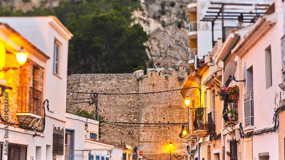 DENIA, SPAIN - JUNE 13, 2019: Old town of Denia with narrow streets and pavement