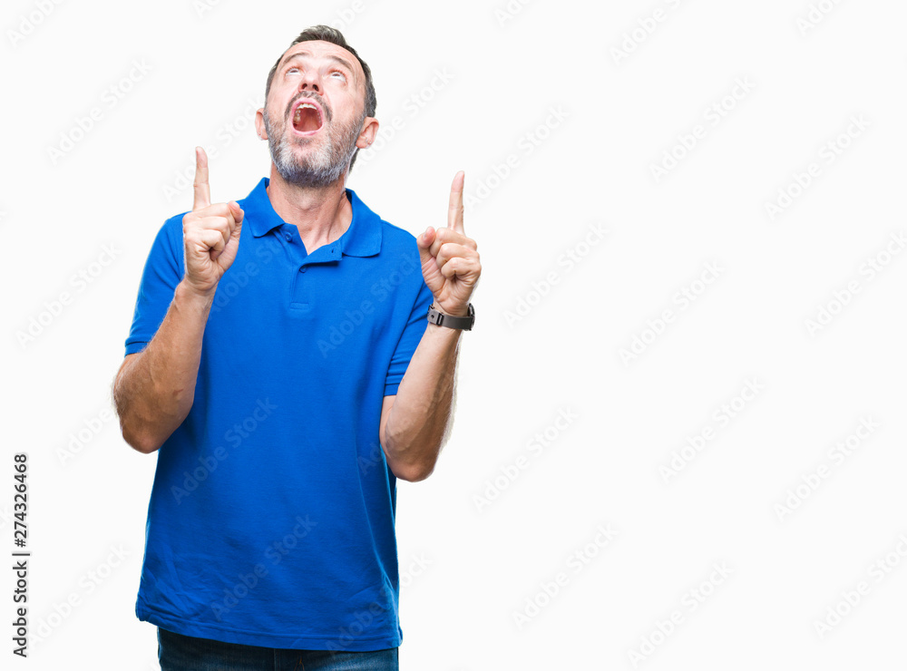 Middle age hoary senior man over isolated background amazed and surprised looking up and pointing with fingers and raised arms. Middle age hoary senior man over isolated background amazed and surprised looking up and pointing with fingers and raised arms.