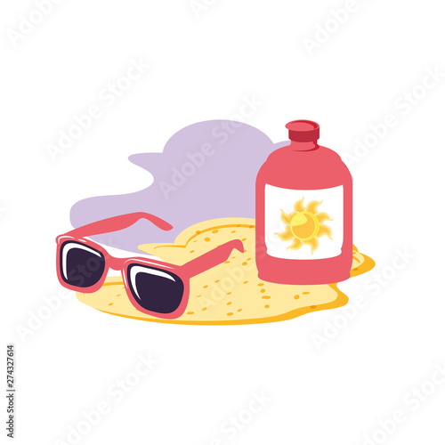solar blocker bottle in the beach with sunglasses