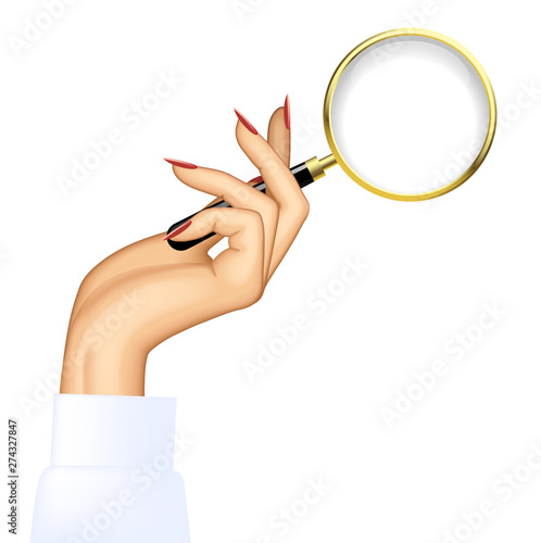 Woman's hand with an old magnifying glass