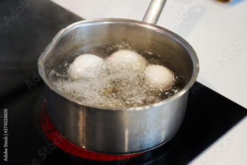 Preparing food on casserole pan on a electric stove, close-up. Cook egg process