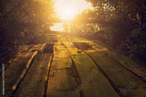 sunset over the old wooden bridge