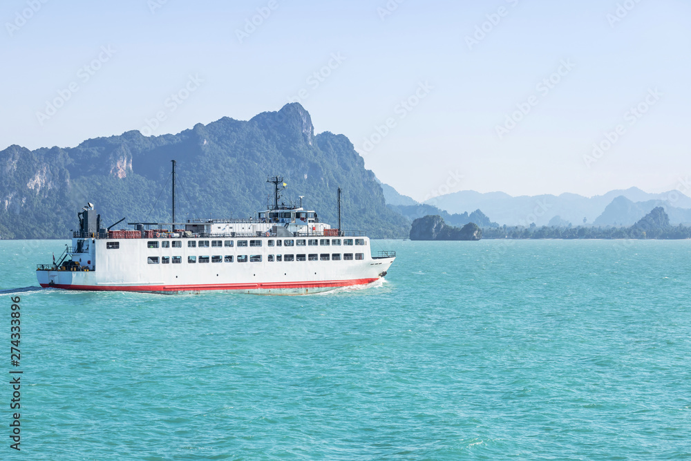 Large ferryboat carrying passengers and cars crossing in blue sea  between Samui island and Surat Thani province, Thailand cargo logistics transportation delivery concept.