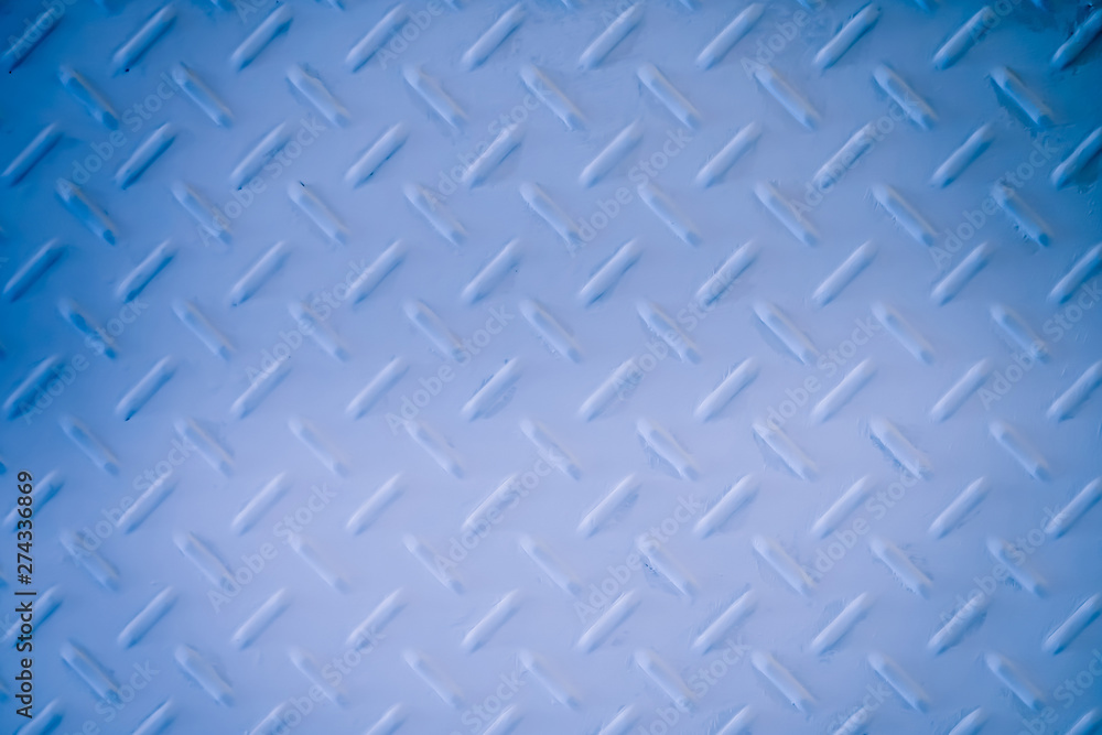 White and blue metal diamond plate wall texture background. White and blue metal diamond plate wall texture background.