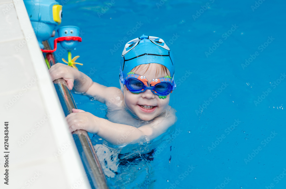 child swimming in the pool