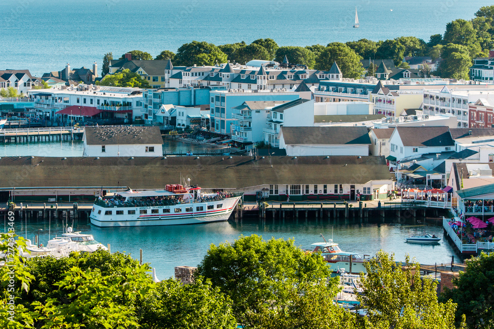 The Mackinac Island Harbor and downtown during the middle of a sunny summer day
