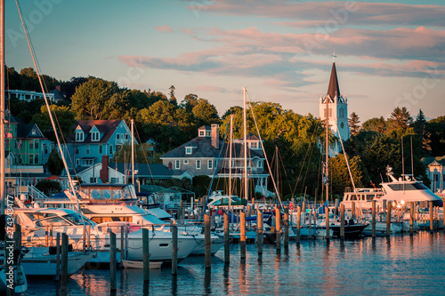 The Marina at Mackinac Island with Saint Anne's church and the historic Victorian houses a sunset shot from Lake Michigan photo