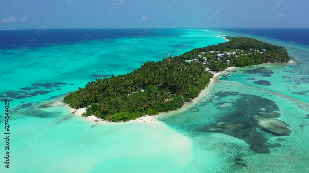 aerial drone dolly out shot of tropical island with palm forest and white beach, luxury resort, Caribbean sea with turquoise water coral reef. aerial drone dolly out shot of tropical island with palm forest and white beach, luxury resort, Caribbean sea with turquoise water coral reef.