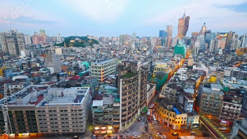 Timelapse of Colorful Macau sunset from the top point with a view on downtown traffic. photo