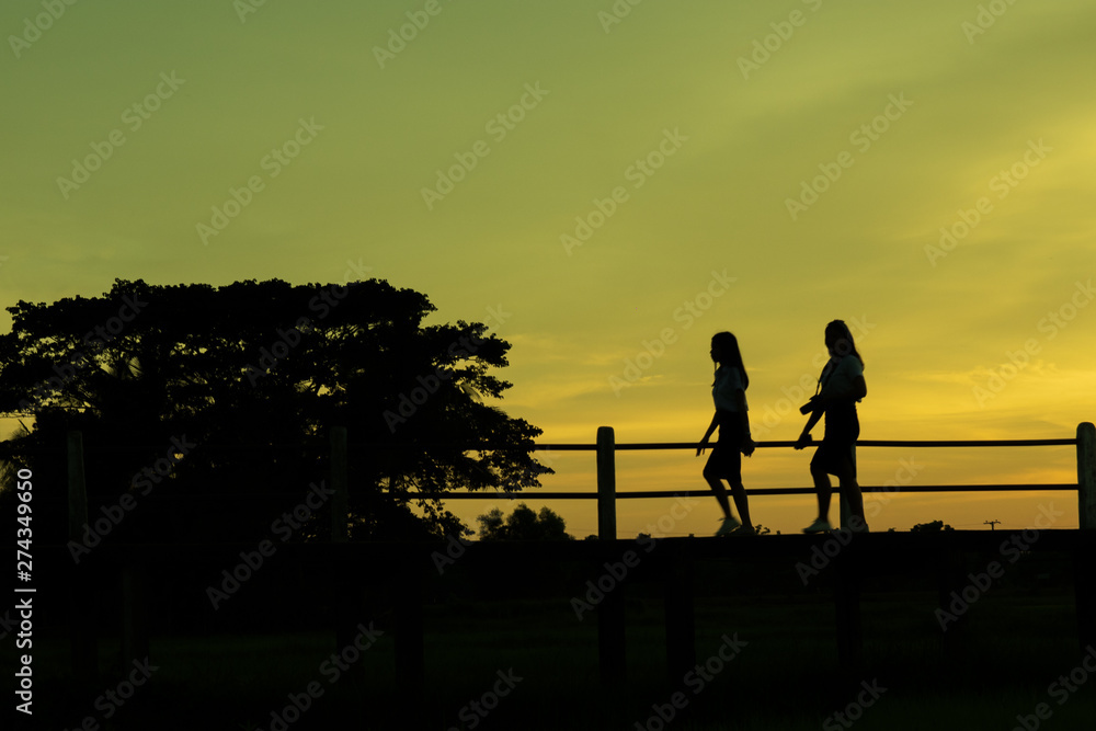 children playing in sunset