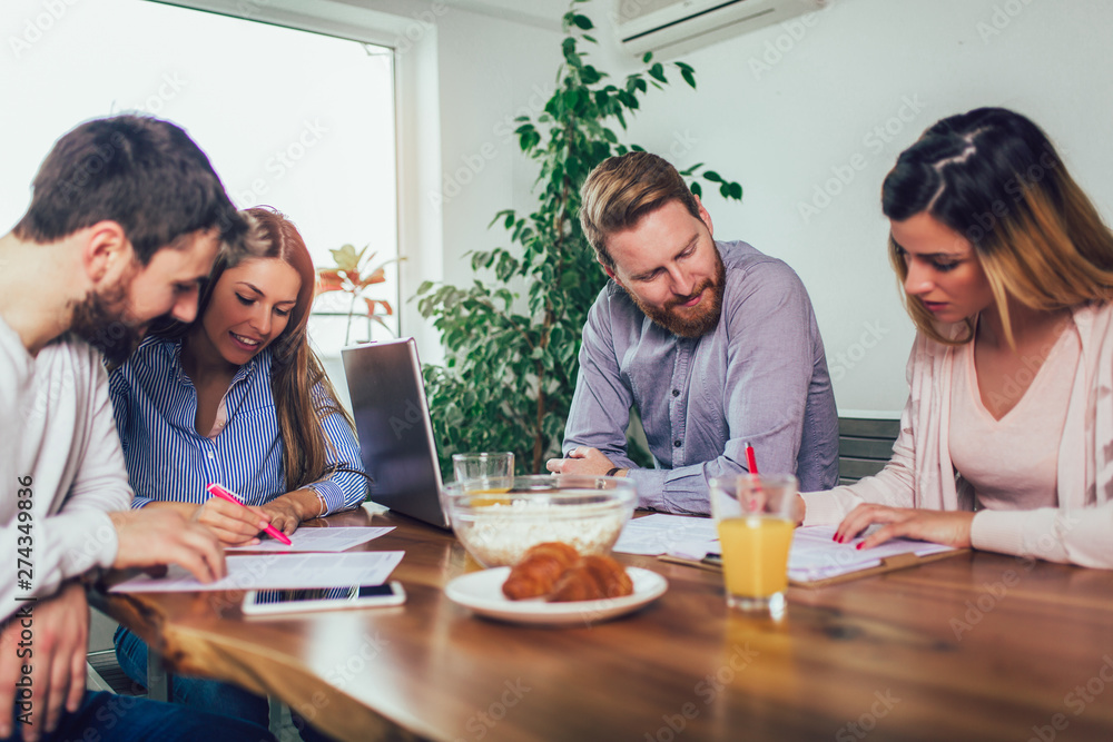 Successful start-up team in training. Business team working on marketing strategy. Brainstorming meeting concept. Successful start-up team in training. Business team working on marketing strategy. Brainstorming meeting concept.