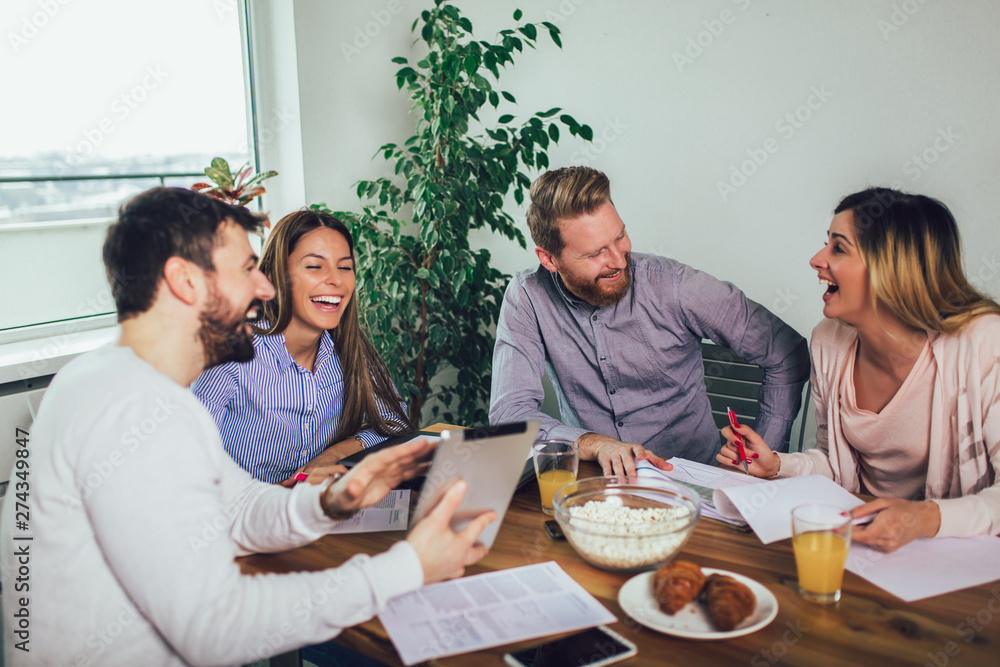 Successful start-up team in training. Business team working on marketing strategy. Brainstorming meeting concept. Successful start-up team in training. Business team working on marketing strategy. Brainstorming meeting concept.