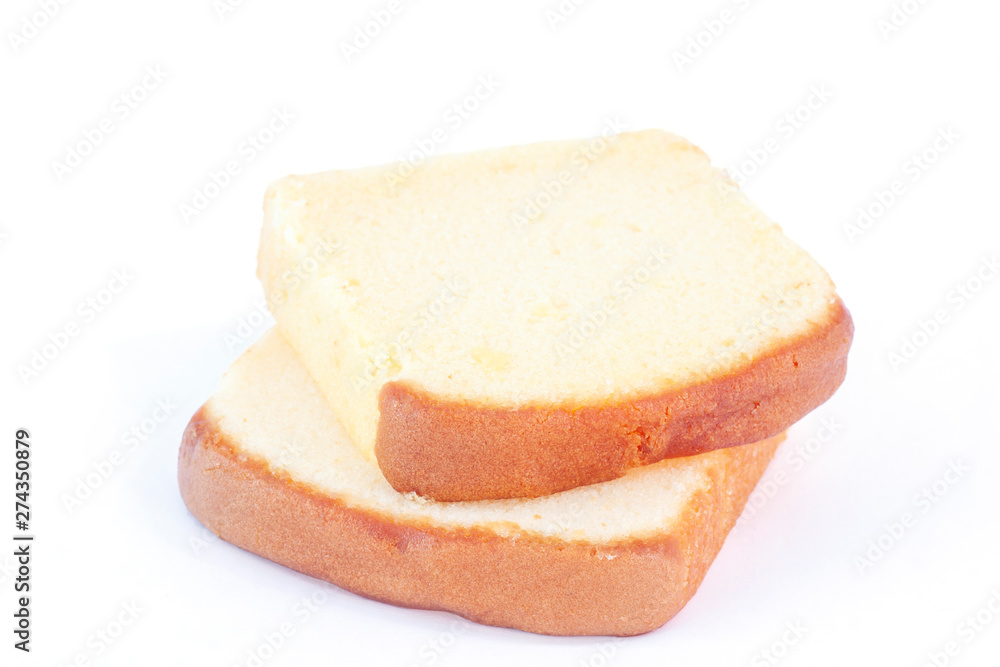 Sliced butter cake isolated on white background.