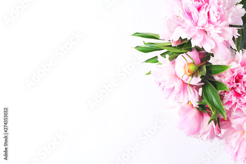 bouquet of light pink peonies on a white background. close-up view from the top, copy space