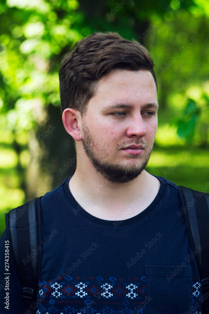 The guy rest after meditating in the city park. The person healthy lifestyle. Tired man in the park. The guy rest after meditating in the city park. The person healthy lifestyle. Tired man in the park.