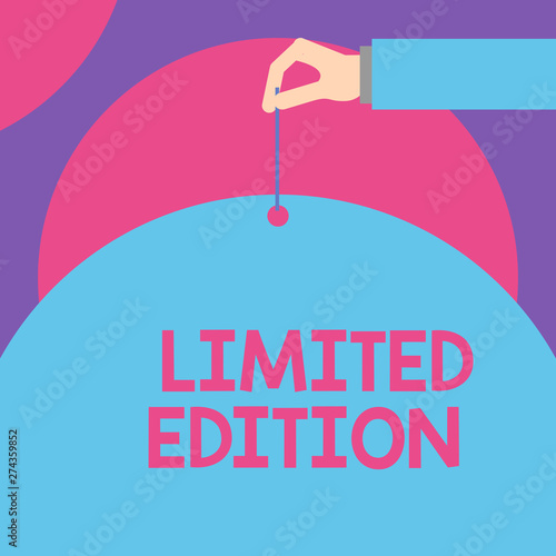 Handwriting text Limited Edition. Conceptual photo Work of something which is only produced in small numbers Male hand arm needle punching big half blank balloon geometrical background photo