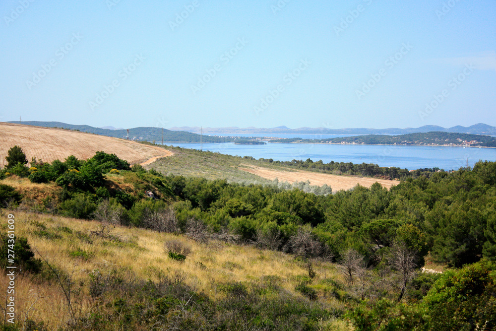 Dalmatian landscape with mountains and Adriatic Sea in wild bushes mastic tree. Dalmatian landscape with mountains and Adriatic Sea in wild bushes mastic tree.