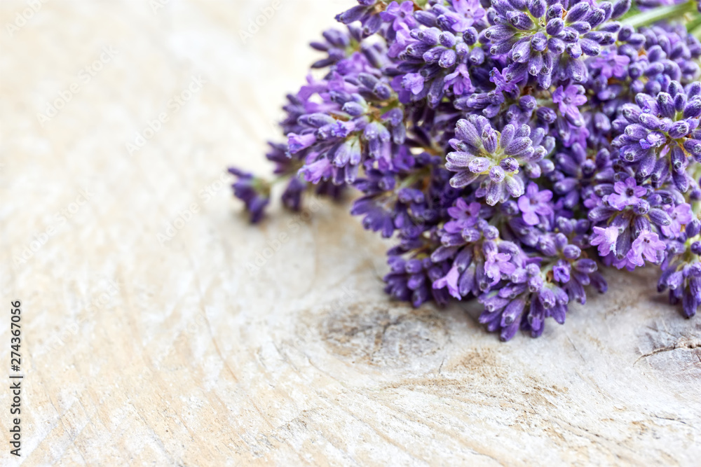 Lavender flowers in deep purple or lilac on old weathered wooden background with copy space Lavender flowers in deep purple or lilac on old weathered wooden background with copy space