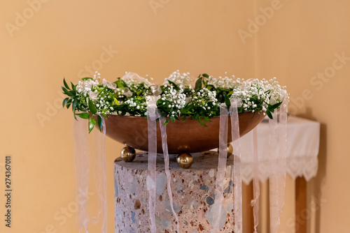 Slika na platnu Baptism font with floral decoration