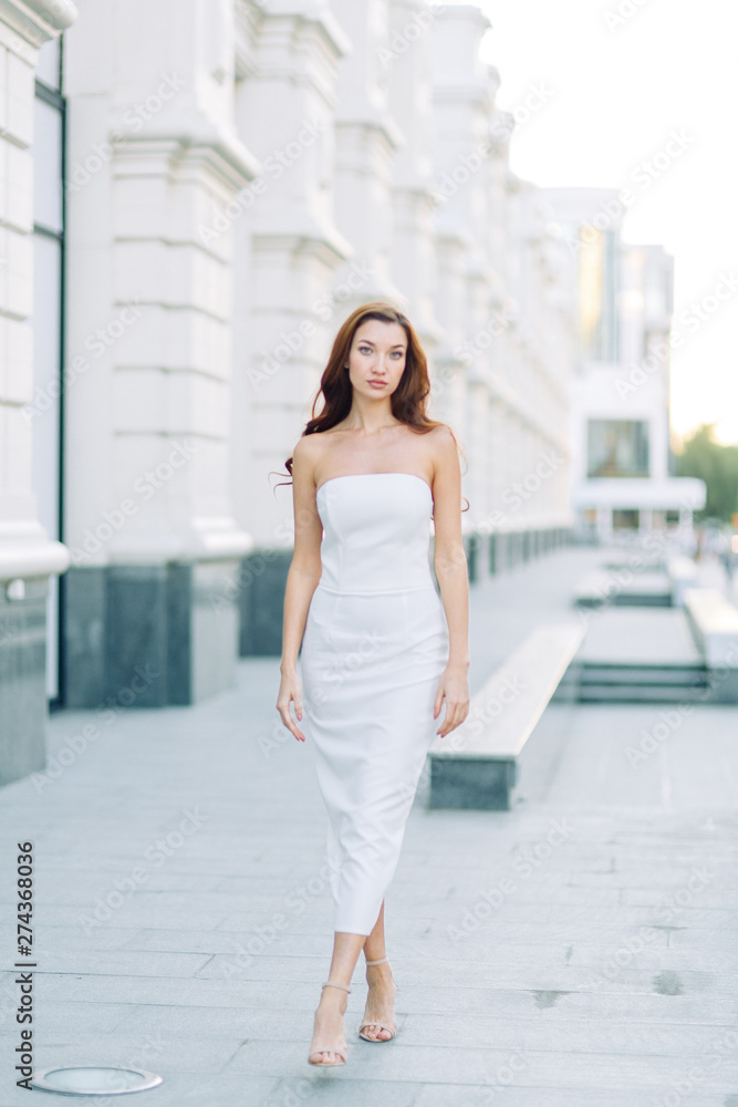 Summer look and white dress. Portraits of an elegant girl with luxury apartments. Summer look and white dress. Portraits of an elegant girl with luxury apartments.