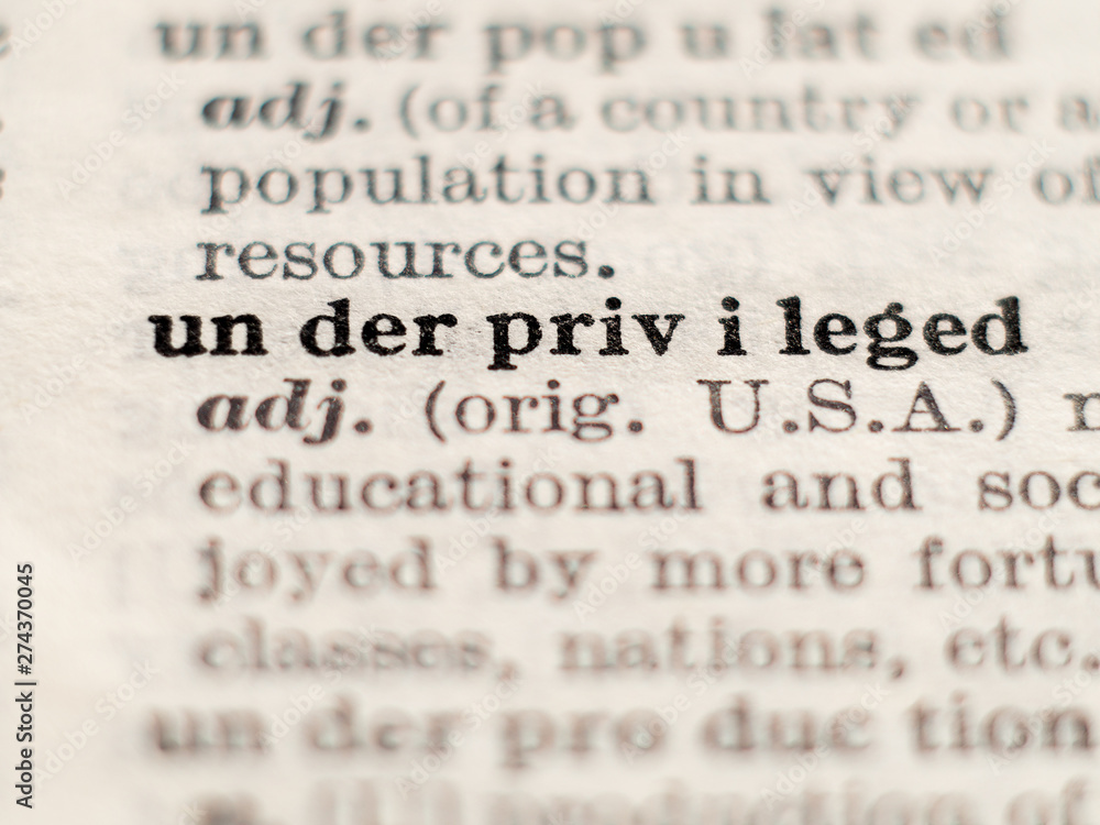 Fototapeta premium Dictionary definition of word underprivileged, selective focus.