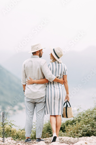 Summer photo shoot at sunset in the Bay of Kotor. Wedding love story with a beautiful couple.