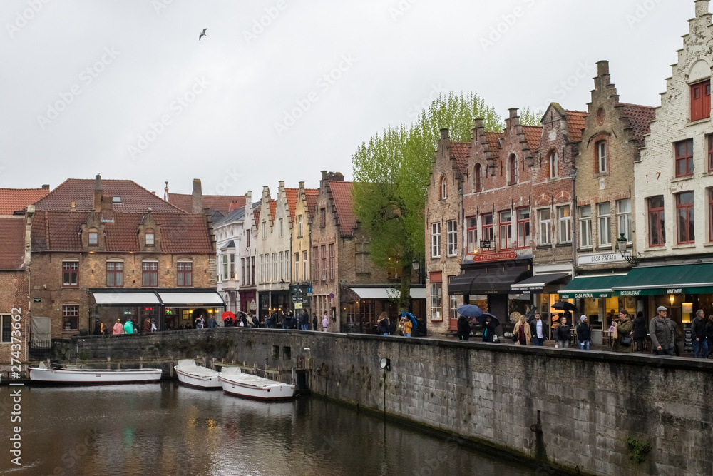Naklejka premium Brugge streets and Architecture with canals and historical buildings. Popular touristic destination of Belgium. Brugge, Belgium