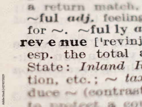 Dictionary definition of word revenue, selective focus.