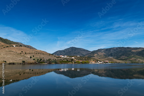 Fototapeta Naklejka Na Ścianę i Meble -  View of Douro River with terraced vineyards near the village of Foz Coa, in Portugal; Concept for travel in Portugal and most beautiful places in Portugal