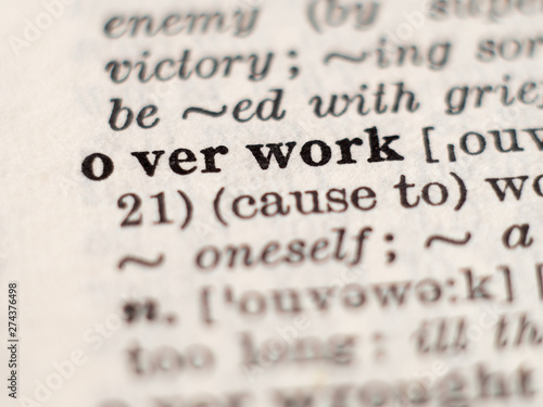 Photography Dictionary definition of word overwork, selective focus.