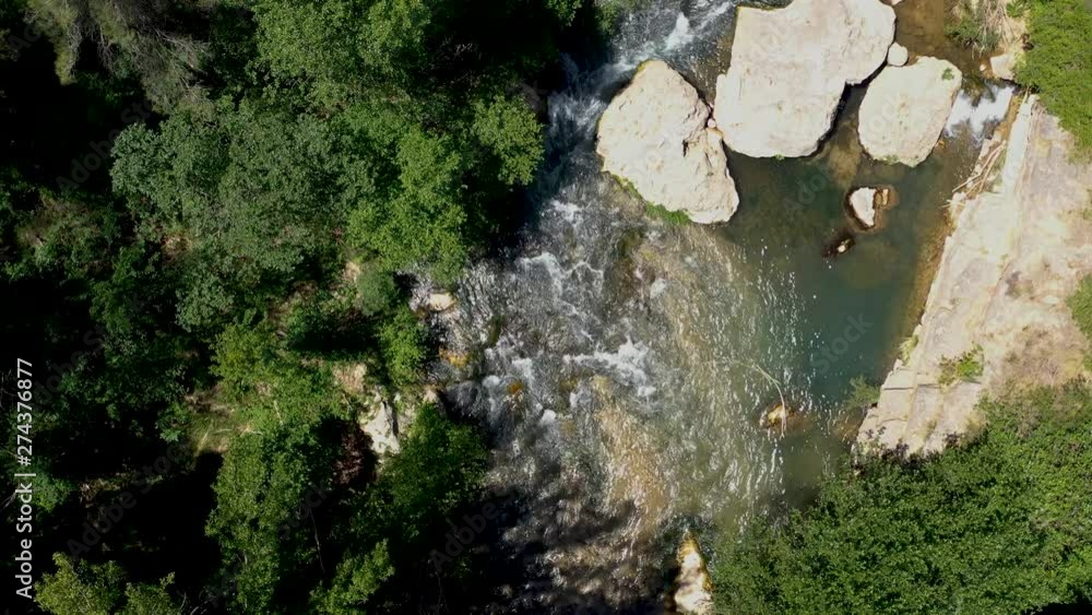 drone flight over a mountain river in argelita spain, water in motion in nature drone flight over a mountain river in argelita spain, water in motion in nature