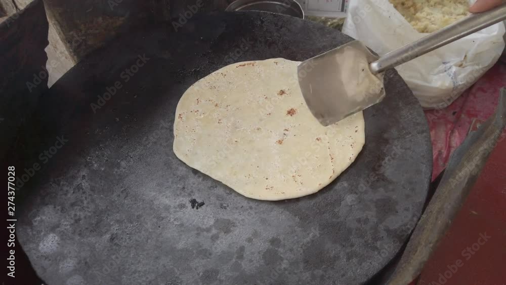Vidéo Stock Slow motion preparation of Paratha, a flatbread that