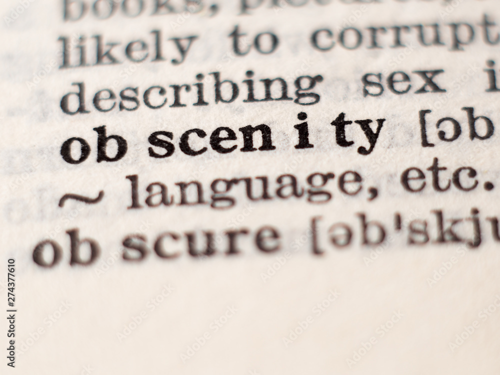 Dictionary definition of word obscenity, selective focus. Dictionary definition of word obscenity, selective focus.