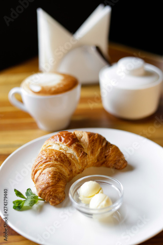 breakfast with coffee and croissant