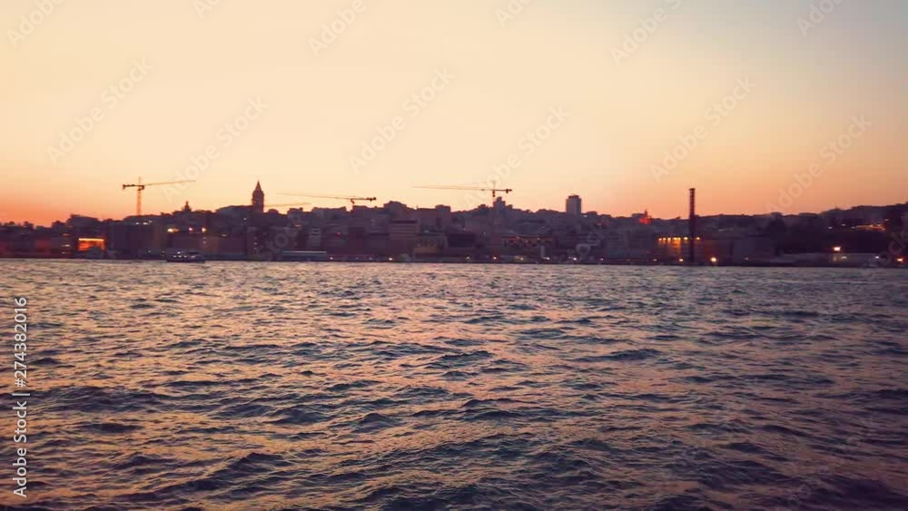 Landscape view of Galate Tower and Bosphorus at sunset while cruising in Istanbul,Turkey. Landscape view of Galate Tower and Bosphorus at sunset while cruising in Istanbul,Turkey.